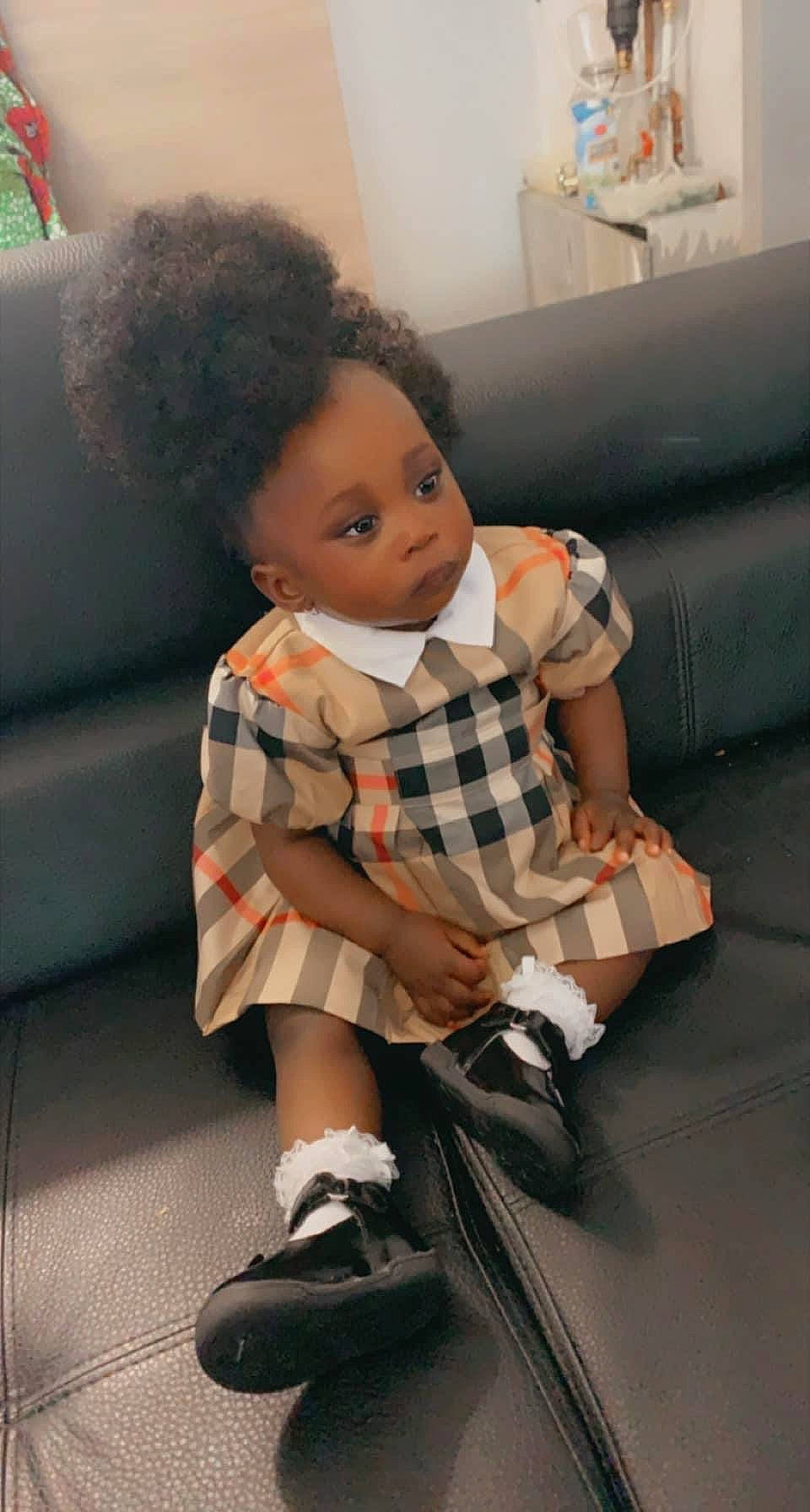 Kimberley participe au concours pour gagner de l'argent avec cette photo : black_hair, child, doll, fashion_design, flooring, formal_wear, fun, human_body, human_leg, joint, knee, luggage_and_bags, pattern, person, plaid, sitting, sock, tartan, thigh, toddler
