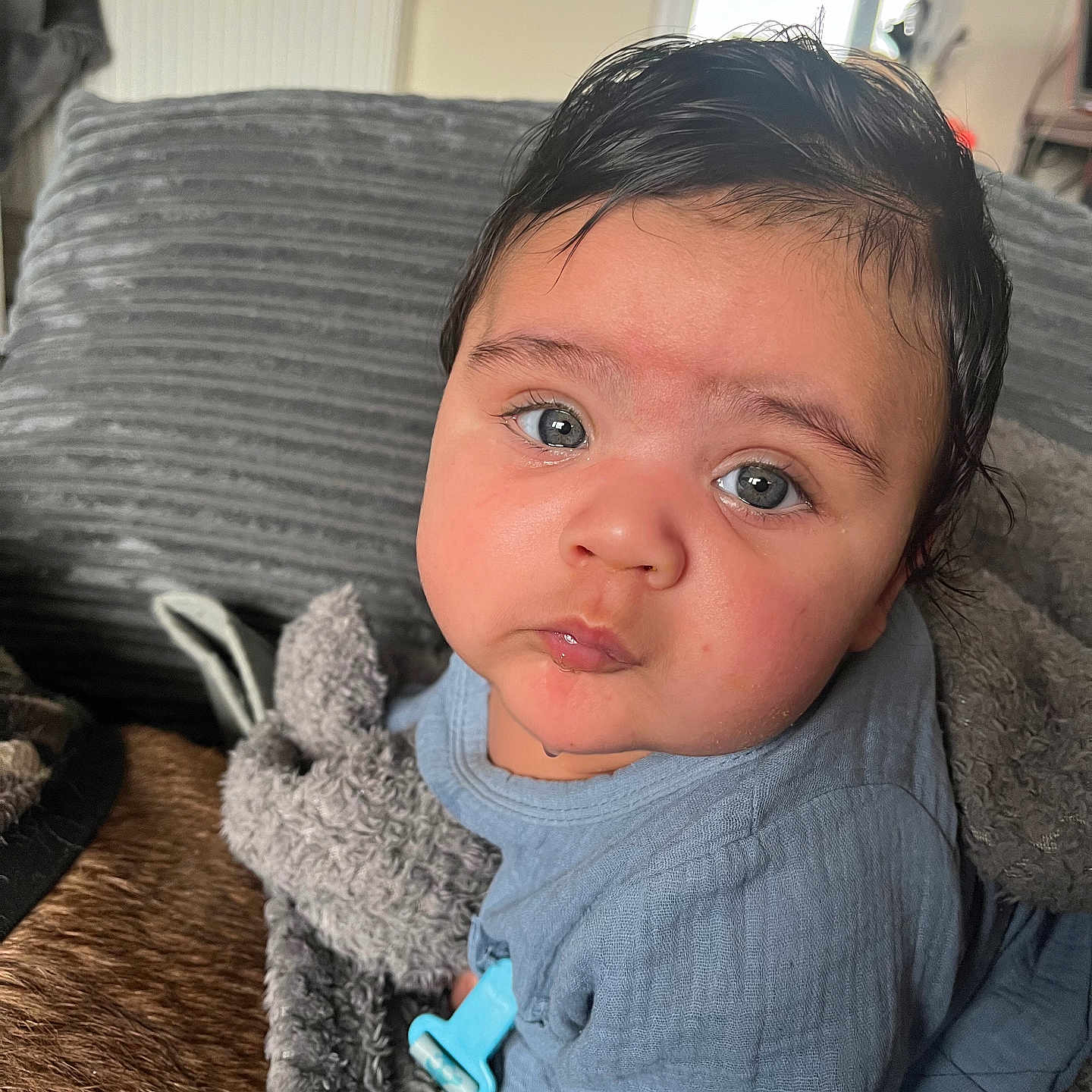 Ragnar is registered to the contest to win money with this photo: baby, bodypart, clothing, couch, cushion, electronics, face, finger, furniture, gun, hand, head, headphones, homedecor, knitwear, person, photography, portrait, sweater, weapon