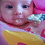 baby, bib, blue_eyes, child, close_up, cute, expression, face, feeding, food, indoor, infant, messy, person, pink, portrait, skin, spoon, yellow, young
