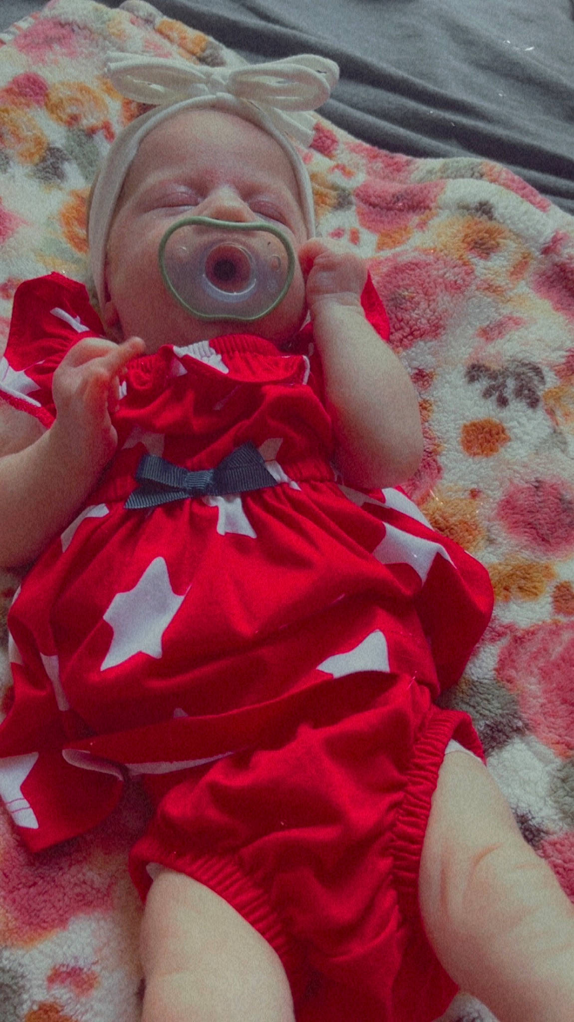 Cecily is registered to the contest to win money with this photo: baby, baby_products, baby_safety, baby_toddler_clothing, child, comfort, eye, finger, head, linens, lip, magenta, mouth, pattern, person, pink, skin, sleeve, textile, thigh