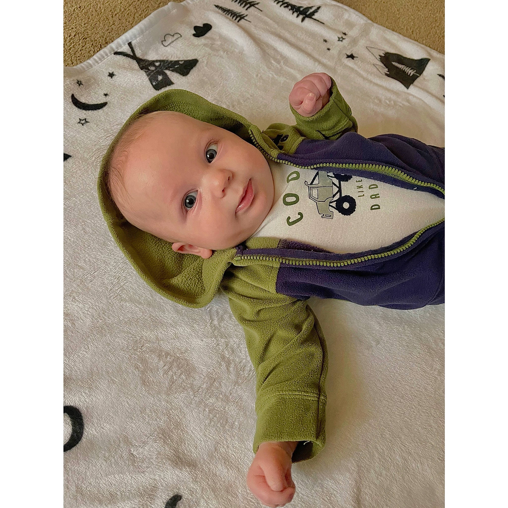 Carson is registered to the contest to win money with this photo: baby, baby_products, baby_safety, baby_toddler_clothing, cheek, collar, comfort, eye, eyelash, face, fashion_accessory, happy, head, linens, outerwear, pattern, person, product, sleeve, smile