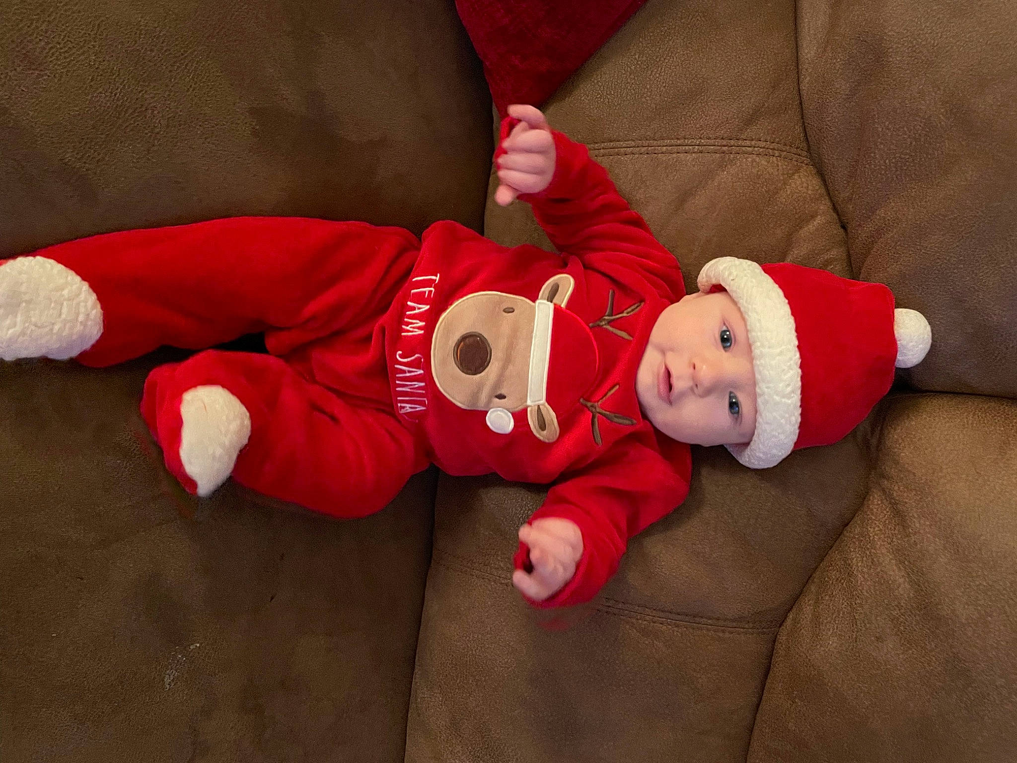Eryksson joined the competition — help win amazing prizes! baby, baby_toddler_clothing, child, christmas, christmas_eve, comfort, costume_hat, event, fictional_character, hand, hat, headwear, holiday, human_body, lap, leg, person, santa_claus, sleeve, smile