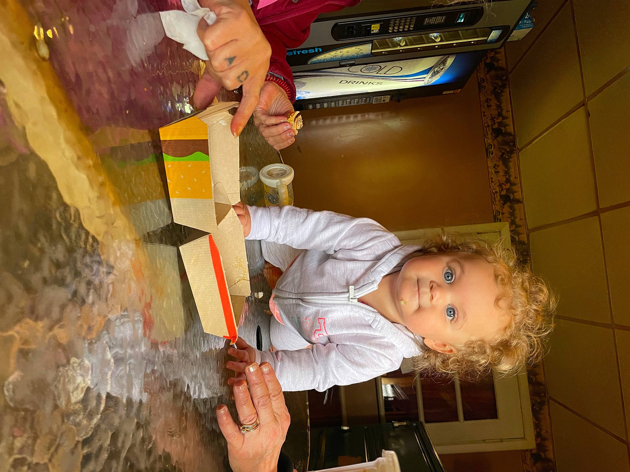 Brinsley is registered to the contest to win money with this photo: baby, child, cooking, food, fun, hand, kitchen, kitchen_appliance, person, refrigerator, room, toddler, wood