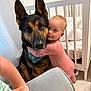 Berkley joined the competition — help win amazing prizes! baby, dog, german_shepherd, hug, onesie, nursery, crib, carpet, earrings, child, pet, indoor, curtain, furniture, comfort, affection, animal, portrait, closeup, love