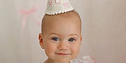 Berkley joined the competition — help win amazing prizes! baby, child, party_hat, smile, portrait, blue_eyes, earrings, face, cute, first_birthday, pink_bows, soft_lighting, closeup, infant, celebration, young_child, apparel, headwear, happy, indoor