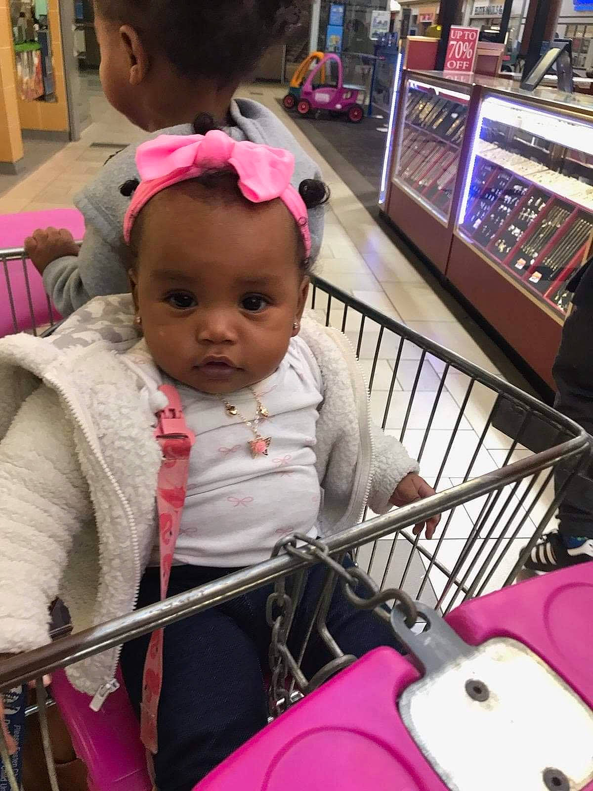 Ledarriona is registered to the contest to win money with this photo: baby, baby_carriage, baby_products, baby_toddler_clothing, cheek, child, fun, happy, head, leisure, mammal, organ, person, photograph, pink, riding_toy, shopping_cart, skin, snapshot, toddler