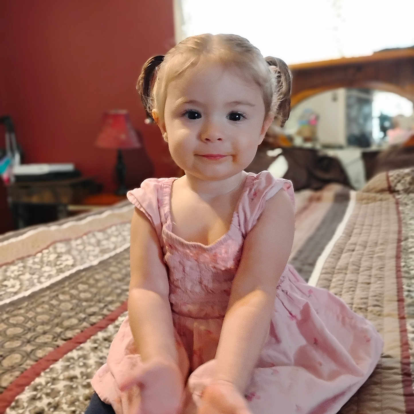 Sarraphena is registered to the contest to win money with this photo: bed, bedroom, child, cozy, cute, furniture, girl, hands, home, indoor, lamp, person, pigtails, pink_dress, portrait, quilt, smiling, soft_lighting, toddler, young_child