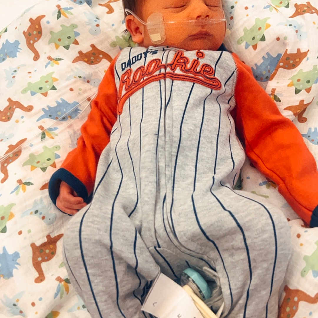 Joaquin joined the competition — help win amazing prizes! architecture, baby, bed, blanket, building, clothing, cushion, face, footwear, furniture, glove, head, homedecor, hospital, newborn, person, photography, portrait, shoe, sleeping