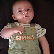 Cole joined the competition — help win amazing prizes! baby, infant, child, overalls, clothing, simba, cute, portrait, face, expression, lying_down, hand, arm, button, striped_shirt, young, skin, head, eyes, indoors