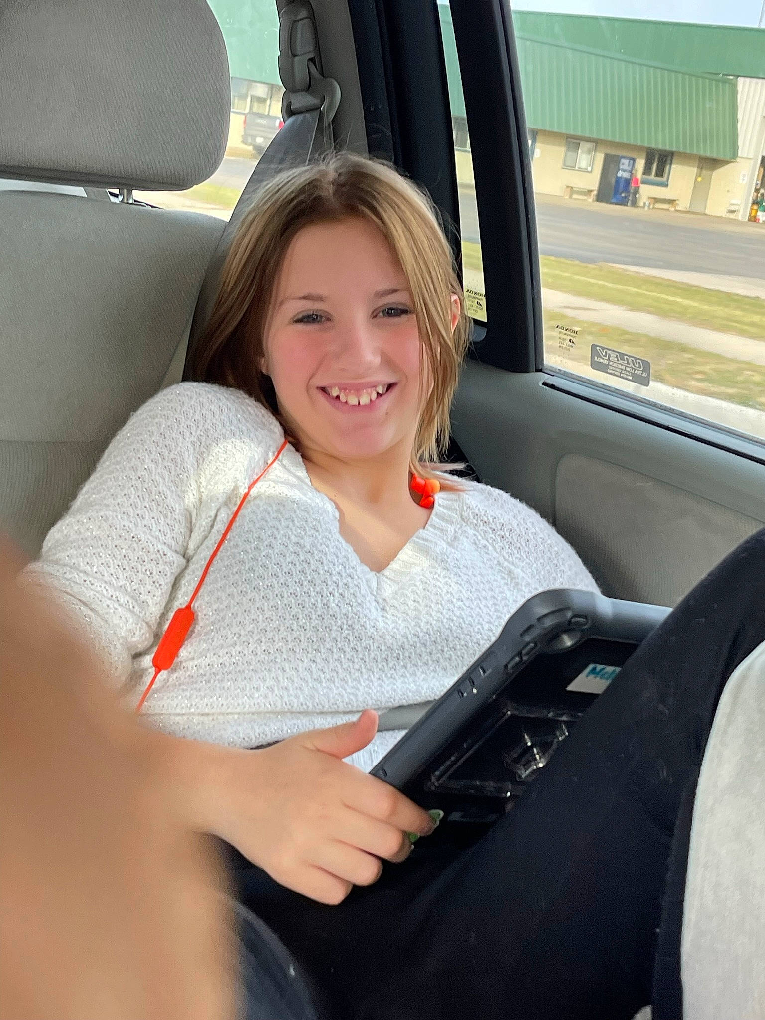 Melany is registered to the contest to win money with this photo: auto_part, automotive_design, automotive_exterior, car, car_seat, car_seat_cover, chair, comfort, head_restraint, joint, joy, leg, motor_vehicle, person, personal_luxury_car, smile, steering_part, steering_wheel, thigh, vehicle