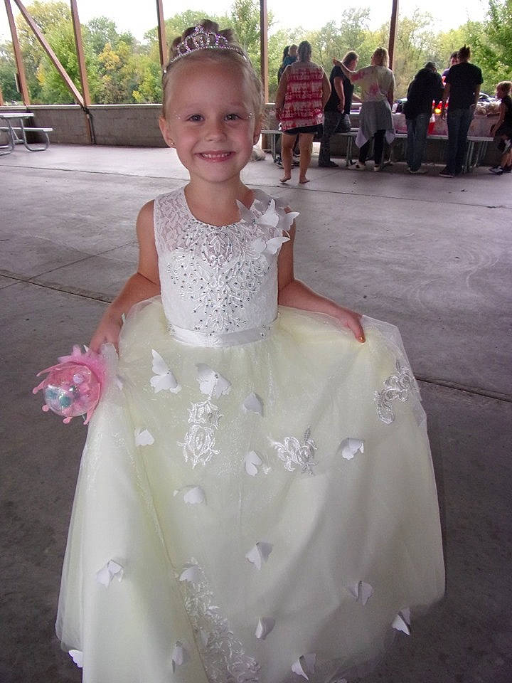 Luvaya is registered to the contest to win money with this photo: bridal_accessory, bridal_clothing, bridal_party_dress, dress, face, facial_expression, formal_wear, fun, gown, hairstyle, happy, joy, person, pink, recreation, skin, sky, sleeve, smile, toddler