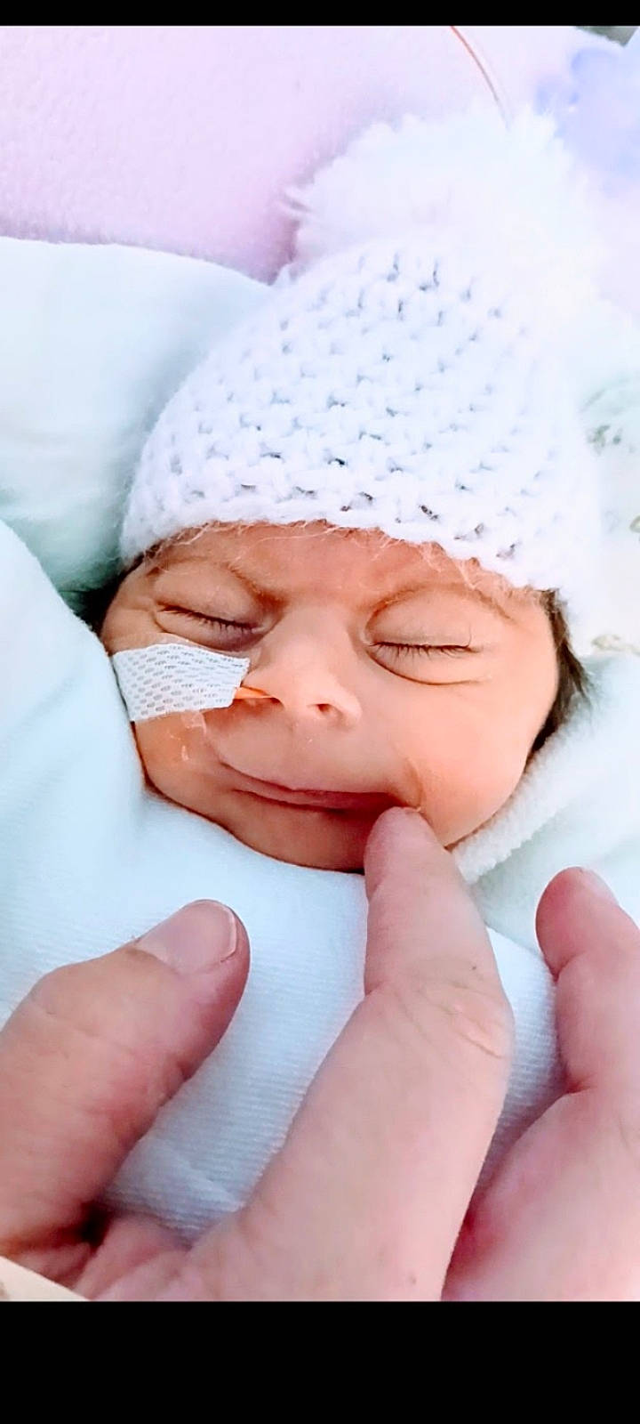 Mylie joined the competition — help win amazing prizes! baby, baby_sleeping, baby_toddler_clothing, cap, cheek, child, comfort, eye, finger, gesture, hand, happy, headwear, linens, lip, nail, nose, person, skin, smile