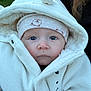 baby, child, face, blue_eyes, hood, hat, jacket, white_clothing, outdoor, portrait, closeup, cute, infant, warm_clothing, person, soft_texture, winter, young_child, expressionless, skin