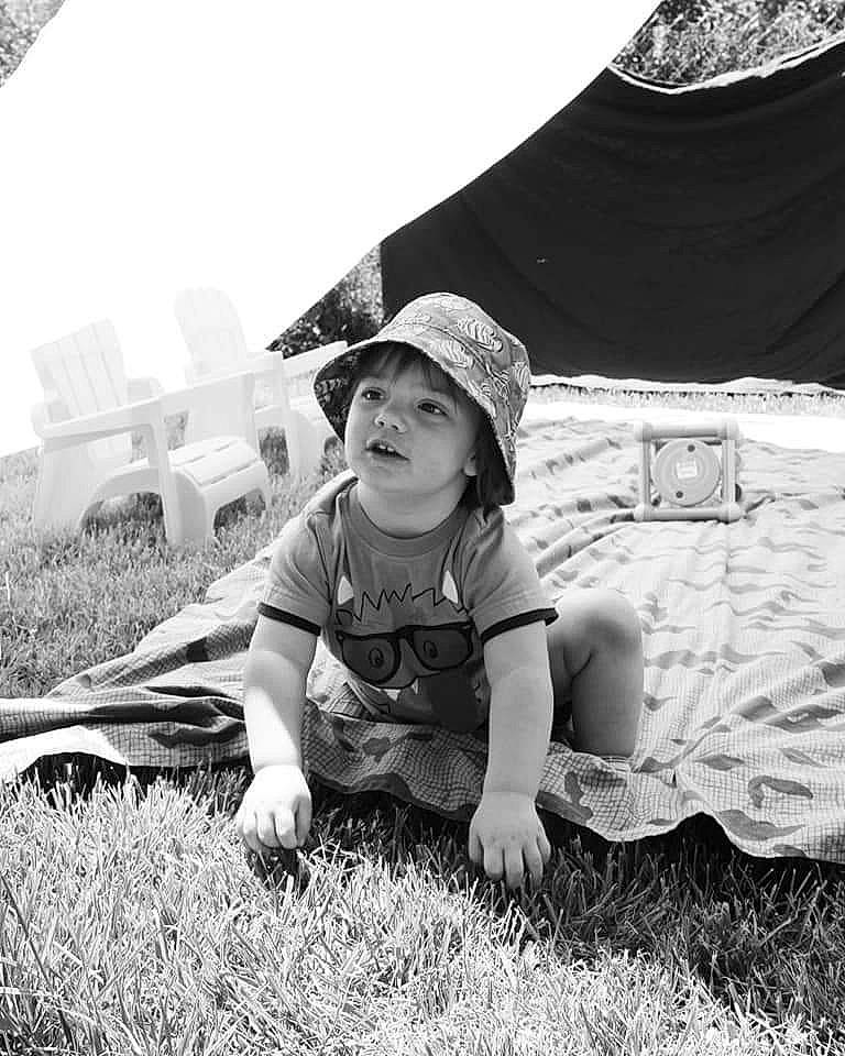Jaden is registered to the contest to win money with this photo: baby, black_and_white, child, fun, grass, headgear, landscape, monochrome, monochrome_photography, people, person, photograph, photography, plant, play, smile, stock_photography, toddler, tree, vacation