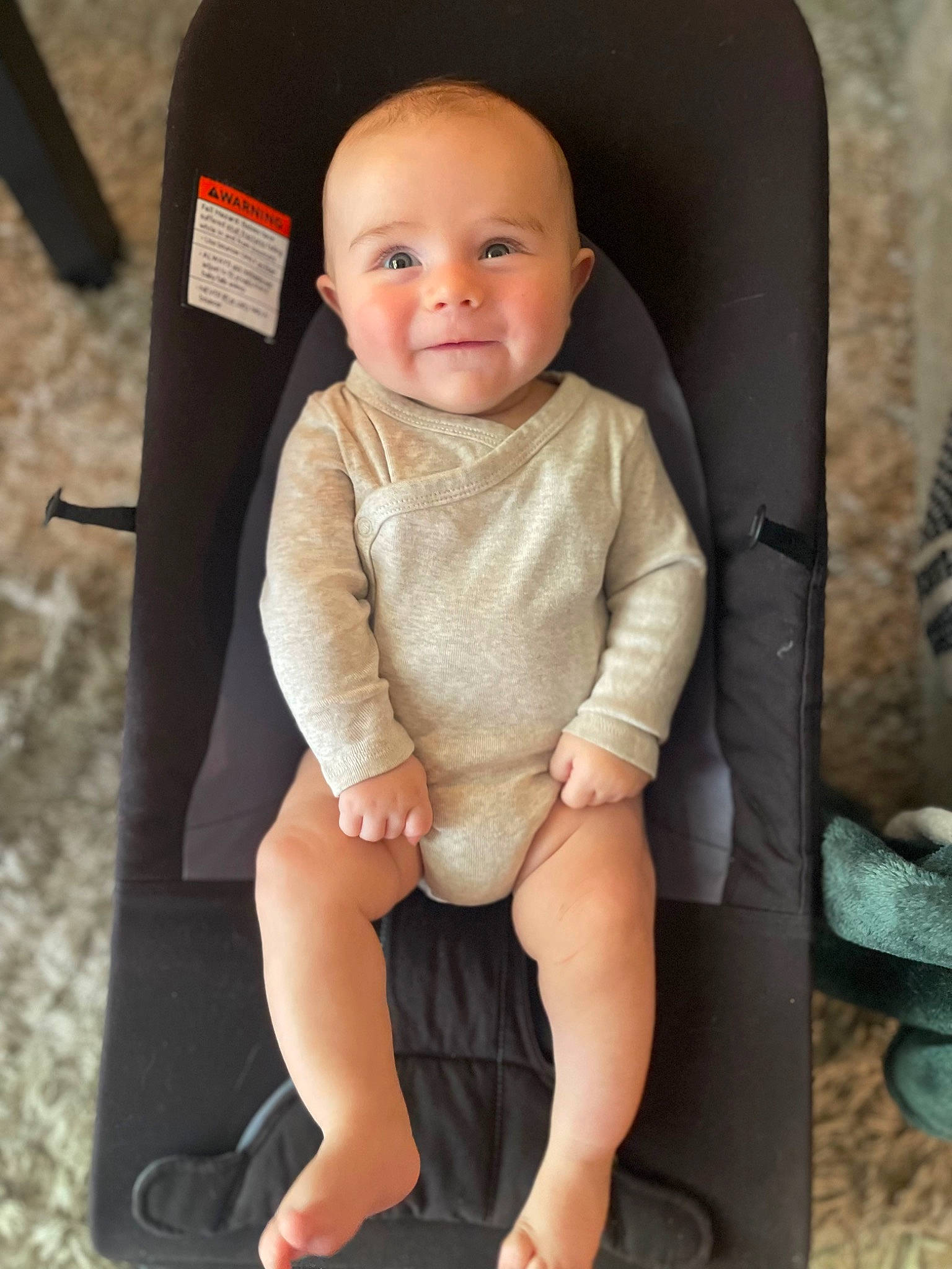 Brooks is registered to the contest to win money with this photo: baby, baby_products, baby_toddler_clothing, car_seat, cheek, child, collar, comfort, eye, face, foot, human_leg, joy, knee, pattern, person, sitting, sleeve, smile, thigh