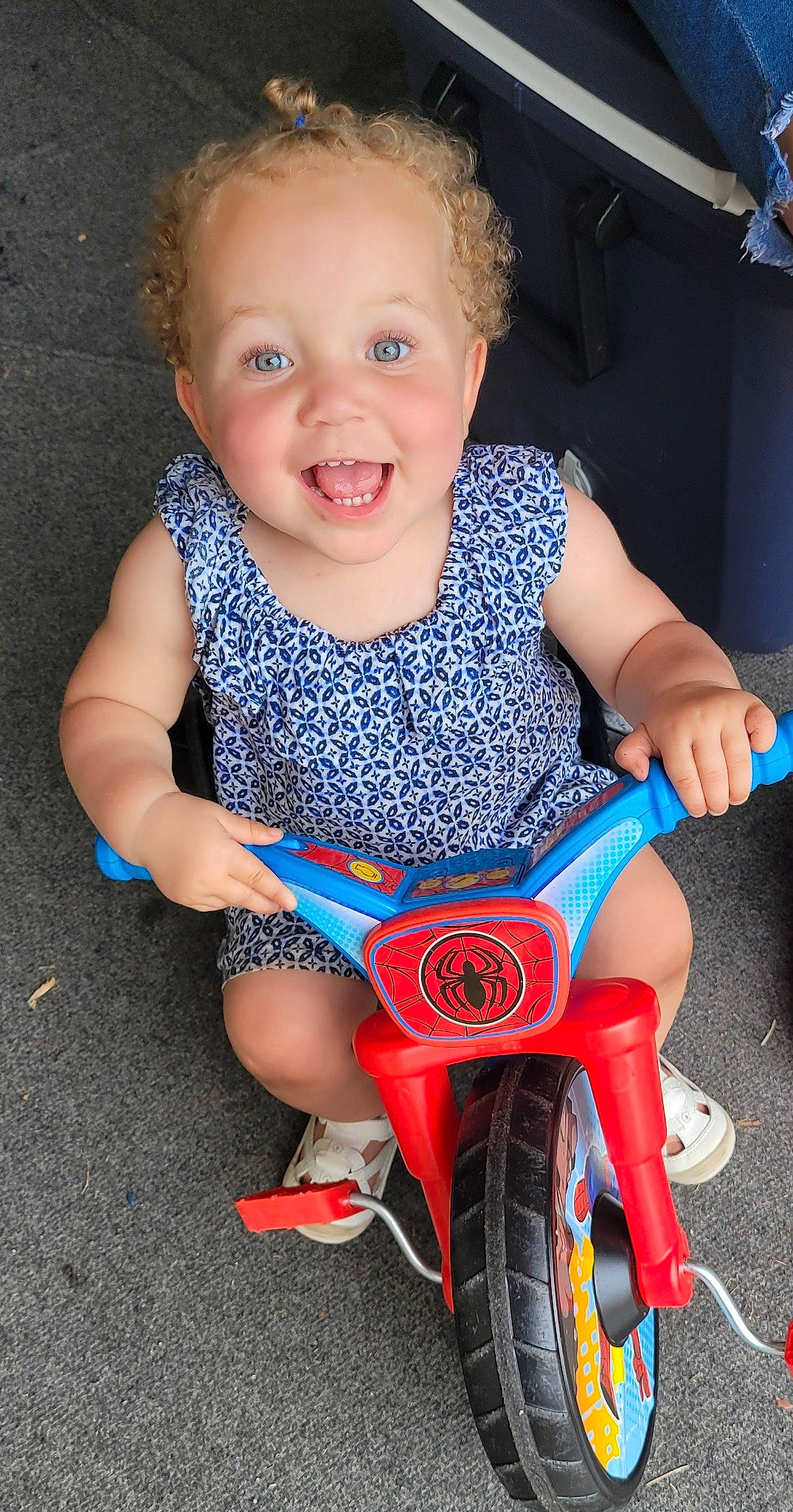 Denise joined the competition — help win amazing prizes! baby, baby_toddler_clothing, blue, cheek, child, electric_blue, eye, finger, fun, hand, happy, joy, organ, person, pink, riding_toy, skin, smile, tire, toddler