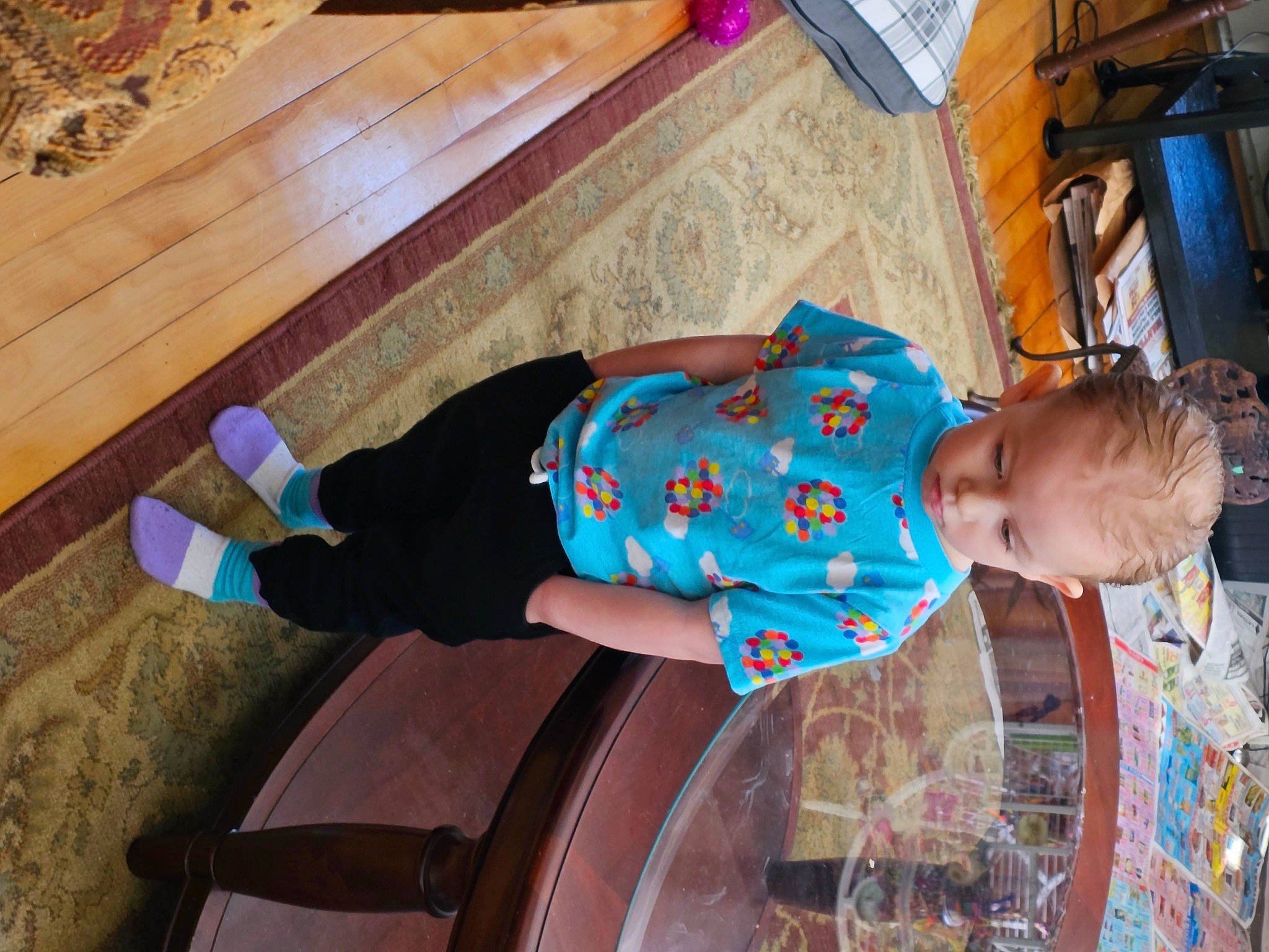 Sabrina-marie is registered to the contest to win money with this photo: baby, baby_toddler_clothing, child, electric_blue, flooring, fun, hardwood, hat, leisure, mammal, pattern, person, play, room, sitting, t_shirt, toddler, tree, vacation, wood