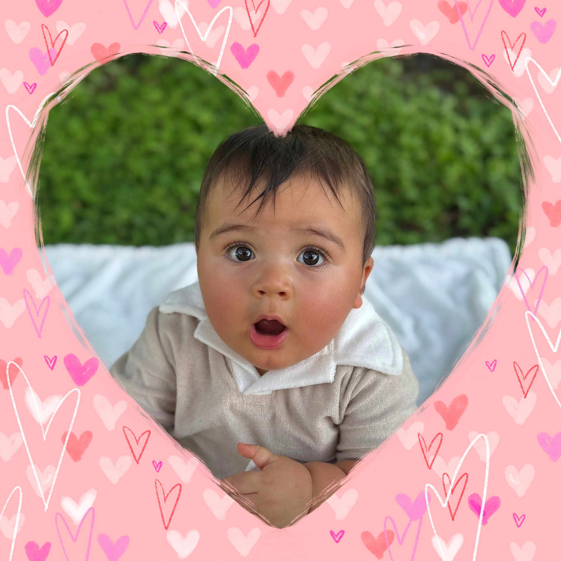 Liam joined the competition — help win amazing prizes! baby, child, face, surprised, expression, heart_frame, pink, purple, doodles, outdoor, grass, blanket, collared_shirt, portrait, cute, young_child, hands, happy, skin, hair