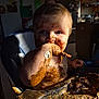 toddler, child, messy, chocolate, cake, high_chair, food, face, hand, fingers, skin, kitchen, indoor, light, shadow, blue_eyes, cute, baby, smudged, eating