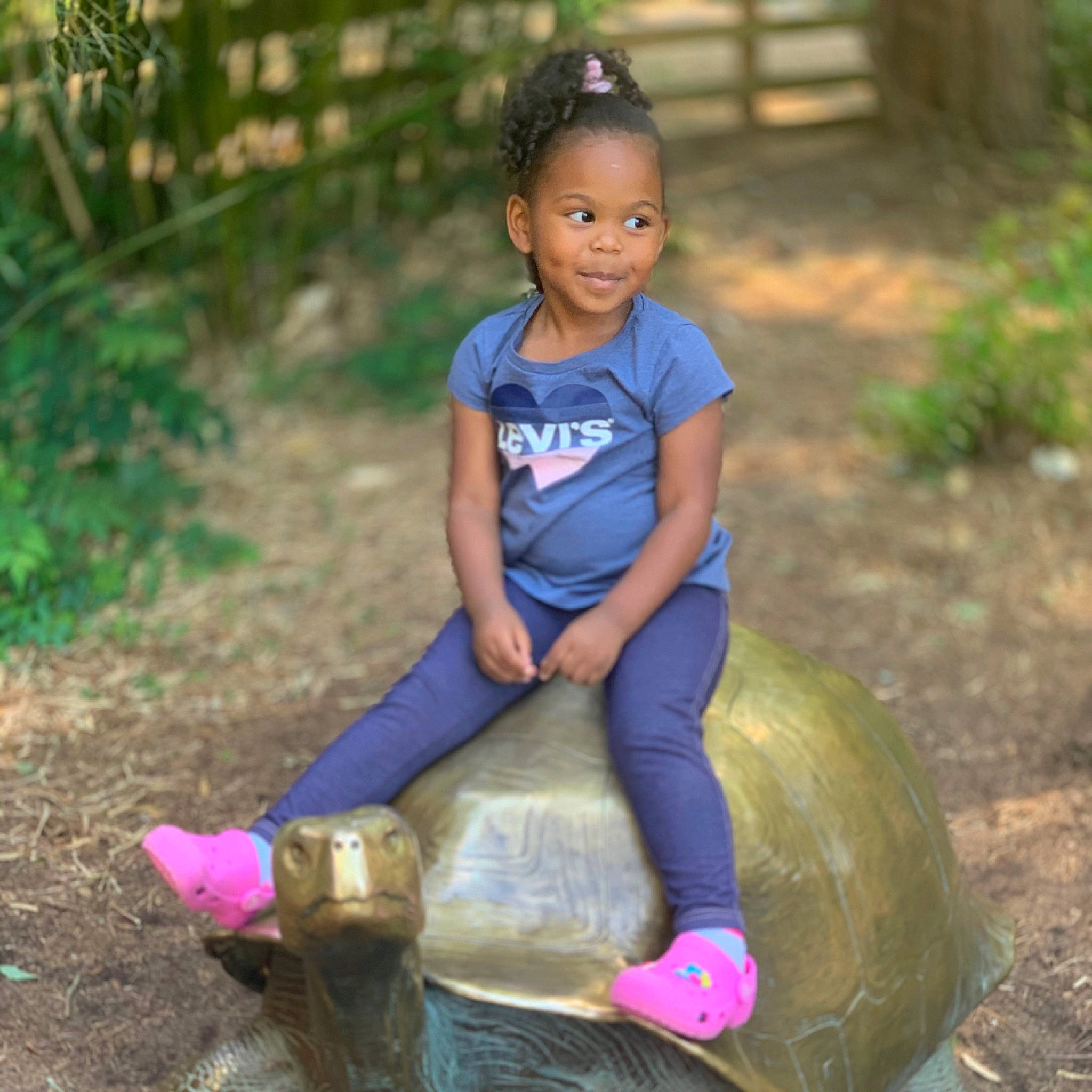 Bria is registered to the contest to win money with this photo: baby_toddler_clothing, boot, botany, electric_blue, footwear, fun, grass, hair, happy, head, human_body, joy, leisure, people_in_nature, person, plant, recreation, shoe, smile, sneakers