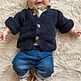 Gabriel participe au concours pour gagner de l'argent avec cette photo : baby, infant, child, smiling, knitted_cardigan, denim_jeans, sneakers, footwear, lying_down, fluffy_rug, cream_rug, casual_clothing, cute, happy, portrait, indoor, person, small_child, cozy, fashion