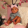 baby, child, pink_bow, headband, pink_chair, flowers, pink_flowers, lace_throw, curly_hair, cute, indoor, portrait, sitting, adorable, infant, soft_lighting, decor, skin, foot, clothing