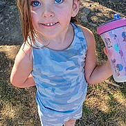 Piper joined the competition — help win amazing prizes! child, girl, blue_eyes, outdoor, tree, sunlight, sippy_cup, mickey_mouse, camouflage_clothing, shorts, sneakers, smile, standing, grass, nature, happy, person, hair, face, playful
