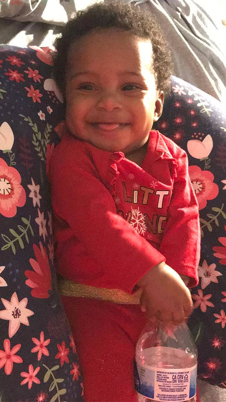 Janiya is registered to the contest to win money with this photo: aguas_frescas, baby, baby_toddler_clothing, cheek, child, happy, joy, laugh, nightwear, nose, person, pleased, sleeve, strawberry_juice, toddler, tooth