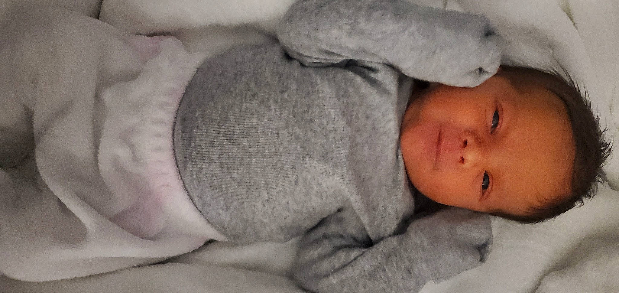 Isaiah is registered to the contest to win money with this photo: arm, baby, baby_sleeping, baby_toddler_clothing, bedtime, cheek, child, comfort, eye, fur, gesture, hand, head, human_body, linens, nap, nose, person, skin, sleeve