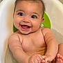 baby, bathtub, water, smile, happy, child, infant, skin, hands, feet, sitting, playful, cute, bath, water_droplets, face, young_child, joy, expression, indoors