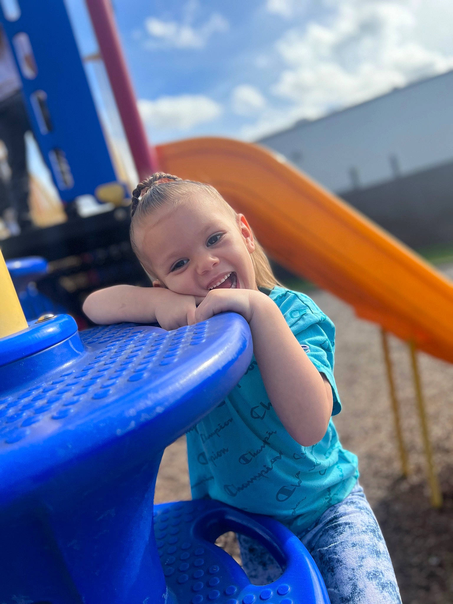 Ariyah joined the competition — help win amazing prizes! aqua, automotive_tire, azure, blue, child, chute, city, cloud, electric_blue, fun, happy, leisure, outdoor_play_equipment, person, playground, playground_slide, recreation, sitting, sky, smile
