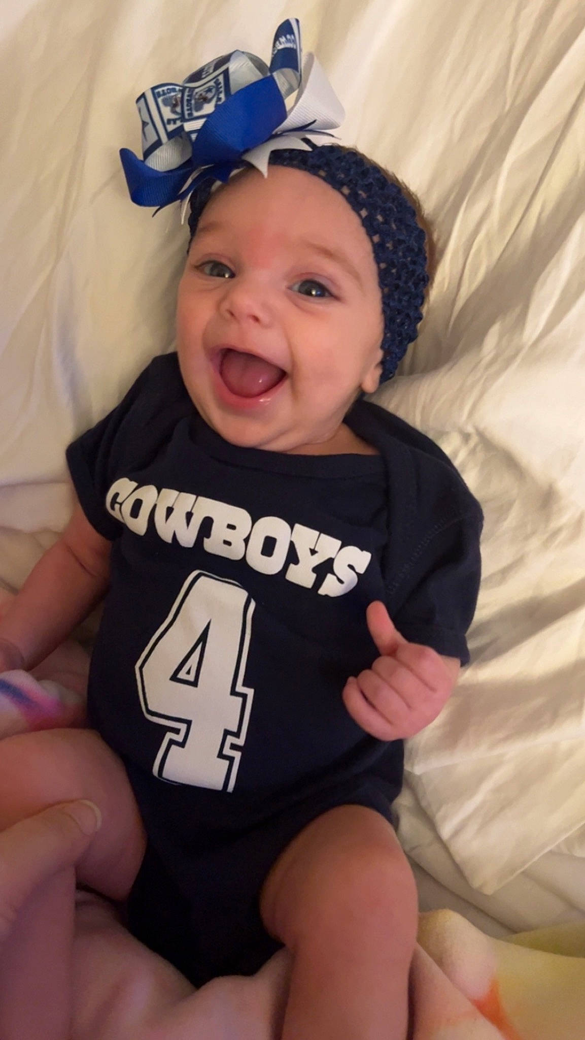 Avery is registered to the contest to win money with this photo: baby, baby_laughing, baby_toddler_clothing, cap, child, cool, eye, eyebrow, face, finger, gesture, happy, headwear, mouth, person, pink, skin, sleeve, smile, t_shirt