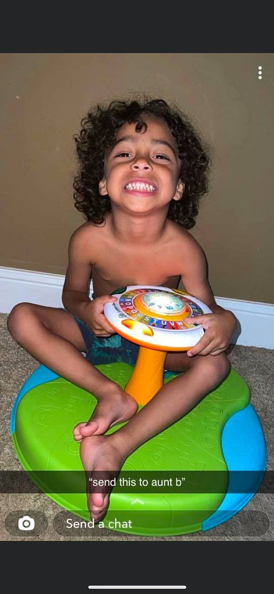 Olyver is registered to the contest to win money with this photo: baby_playing_with_toys, bathing, beauty, child, circle, eye, facial_expression, fun, happy, human_leg, joy, leisure, musical_instrument, person, play, potty_training, sandal, sitting, smile, thigh