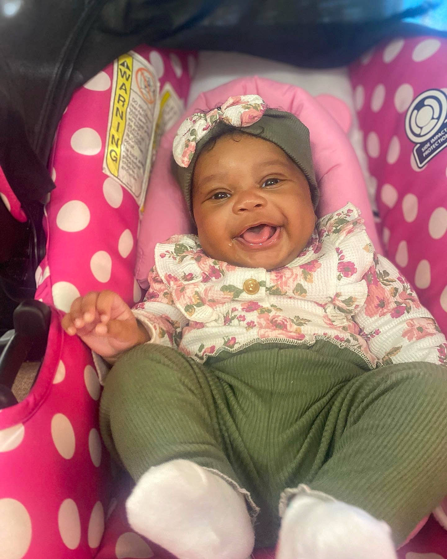 Loyalty joined the competition — help win amazing prizes! baby, baby_products, baby_toddler_clothing, car_seat, child, comfort, facial_expression, fashion_accessory, fun, happy, headwear, lap, leisure, linens, magenta, pattern, person, pink, sitting, sleeve