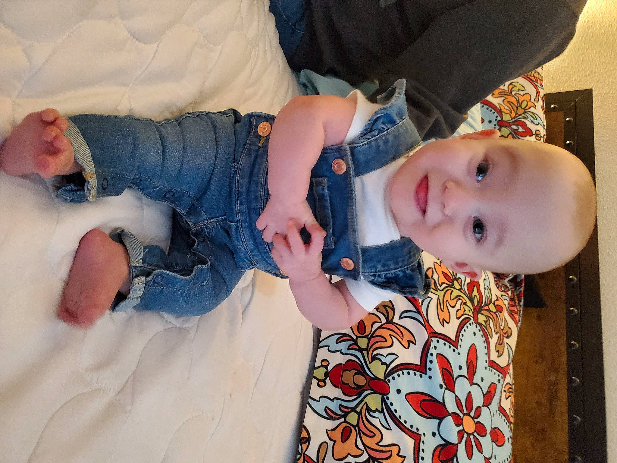 Clementine is registered to the contest to win money with this photo: abdomen, baby, baby_toddler_clothing, cheek, child, comfort, elbow, fun, gesture, happy, head, mouth, nail, pattern, people, person, skin, sleeve, smile, textile