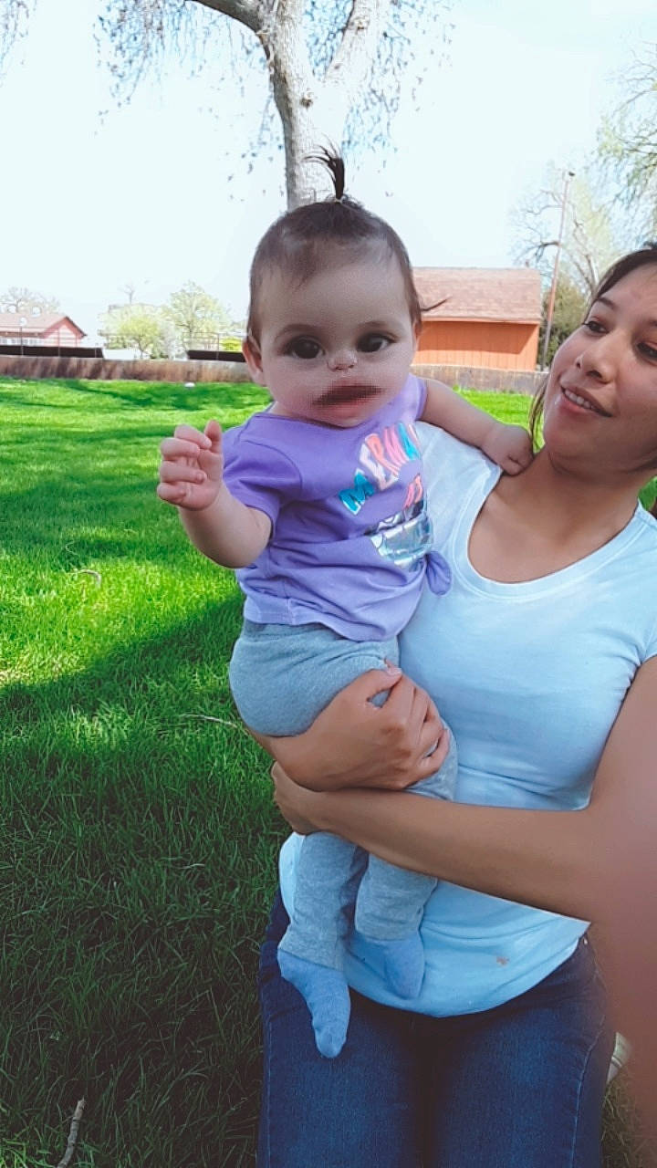 Khia is registered to the contest to win money with this photo: baby, child, daughter, fun, grass, happy, mother, person, skin, smile, toddler