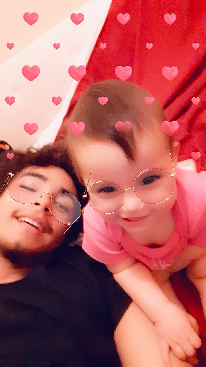 Khia is registered to the contest to win money with this photo: cheek, child, daughter, face, finger, fun, gesture, happy, head, joy, lip, mouth, person, photography, pink, selfie, skin, smile, toddler