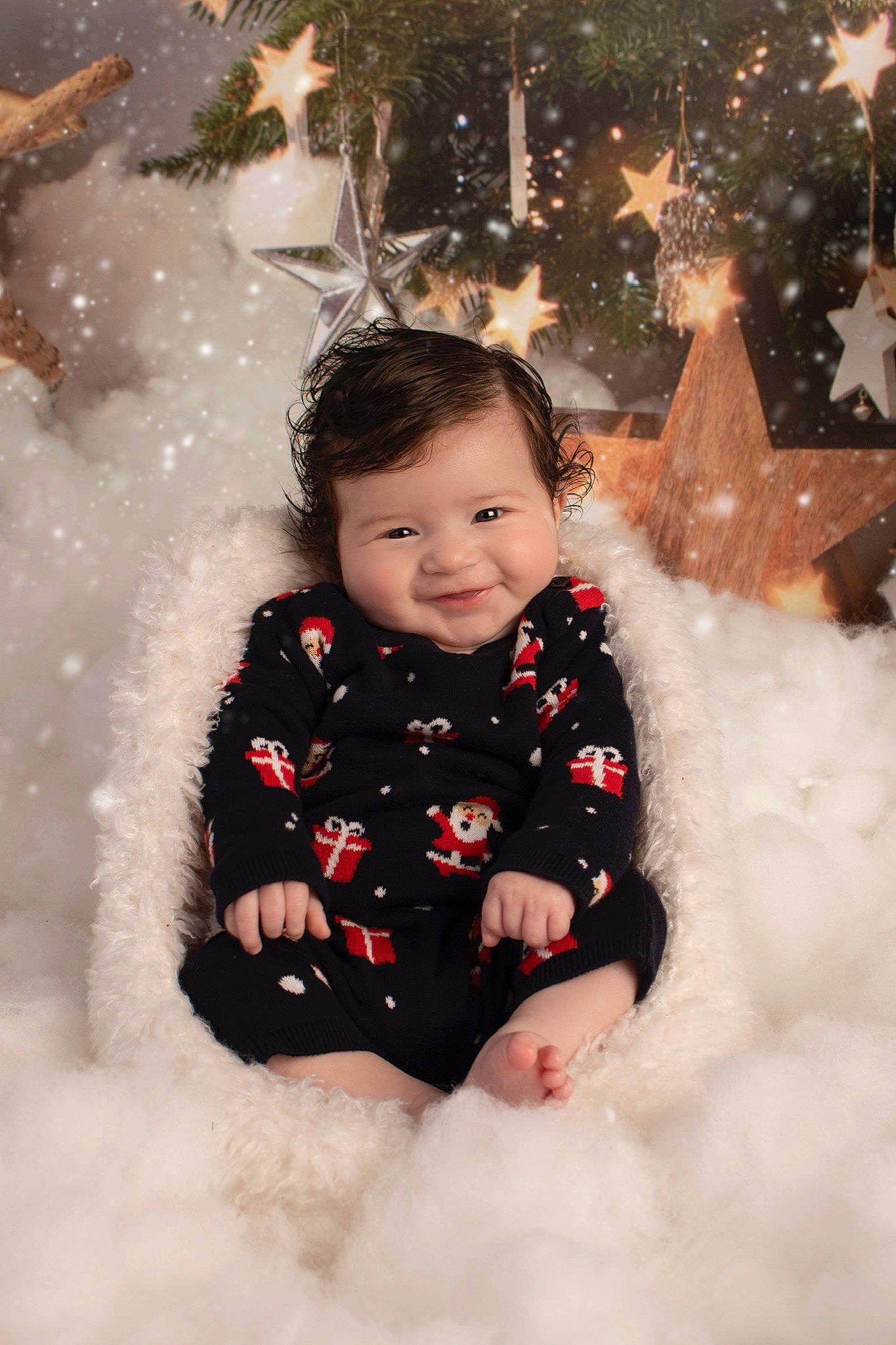Loki is registered to the contest to win money with this photo: baby, cheek, child, eye, freezing, fun, happy, head, joy, person, play, playing_in_the_snow, sitting, skin, smile, snow, toddler, tree, white, winter