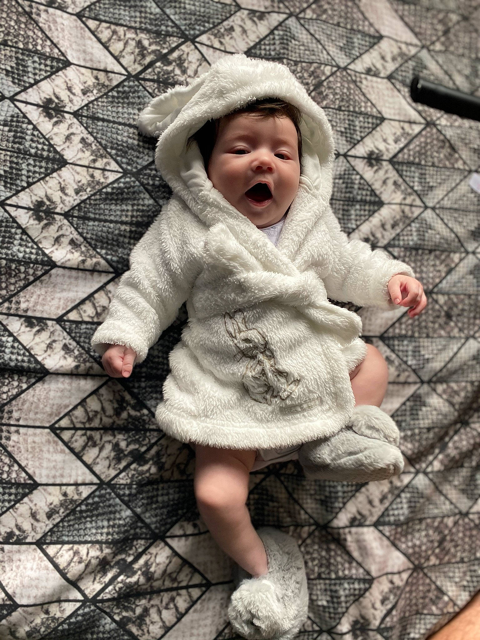 Loki is registered to the contest to win money with this photo: baby, child, facial_expression, outerwear, pattern, person, sleeve, smile, toddler