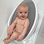 baby, bathtub, bath, bubbles, child, cute, face, happy, infant, naked, person, plastic, seat, smile, skin, water, wet, young, indoors, clean