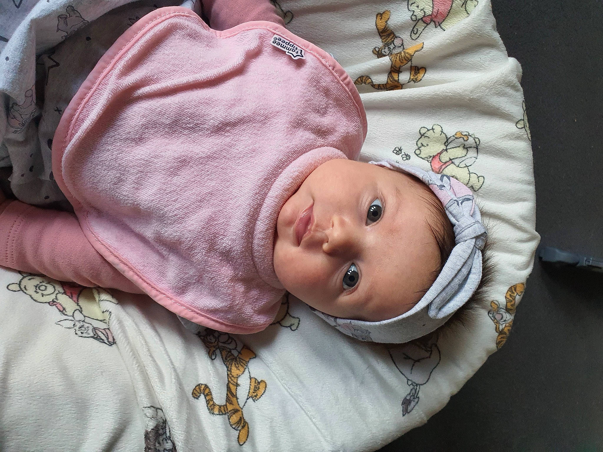 Lacey is registered to the contest to win money with this photo: baby, baby_products, baby_safety, baby_sleeping, baby_toddler_clothing, beanie, cap, cheek, child, comfort, eye, headwear, linens, lip, nose, pattern, person, pink, skin, sleeve