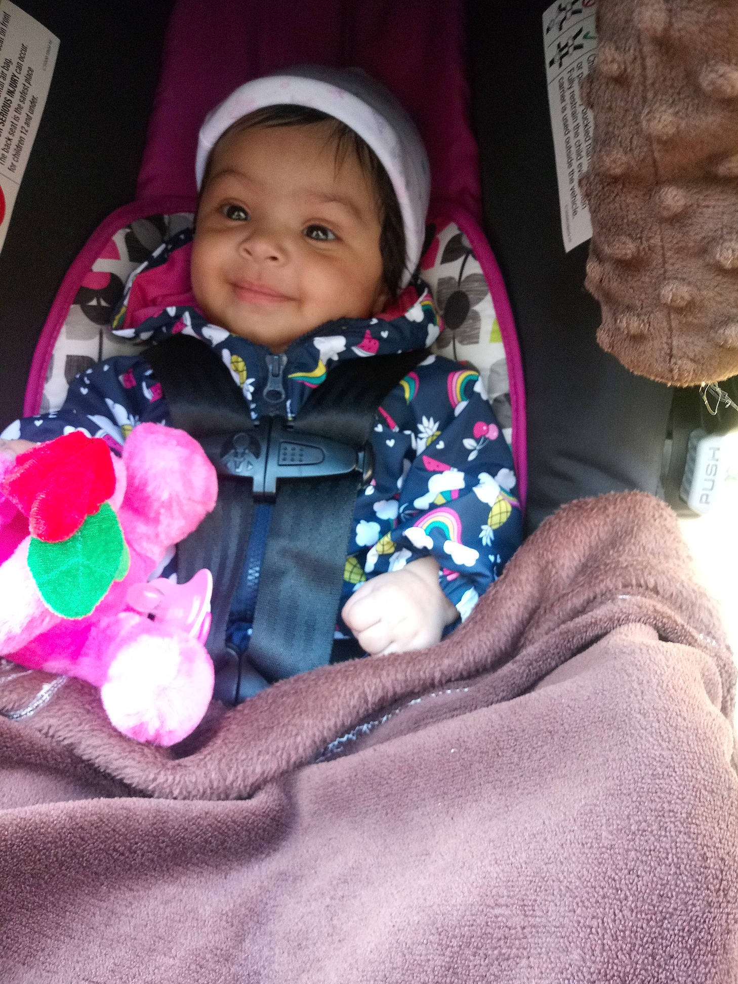 Kaytlin is registered to the contest to win money with this photo: baby, car_seat, cheek, child, fun, joy, person, pink, sitting, skin, smile, toddler, vacation