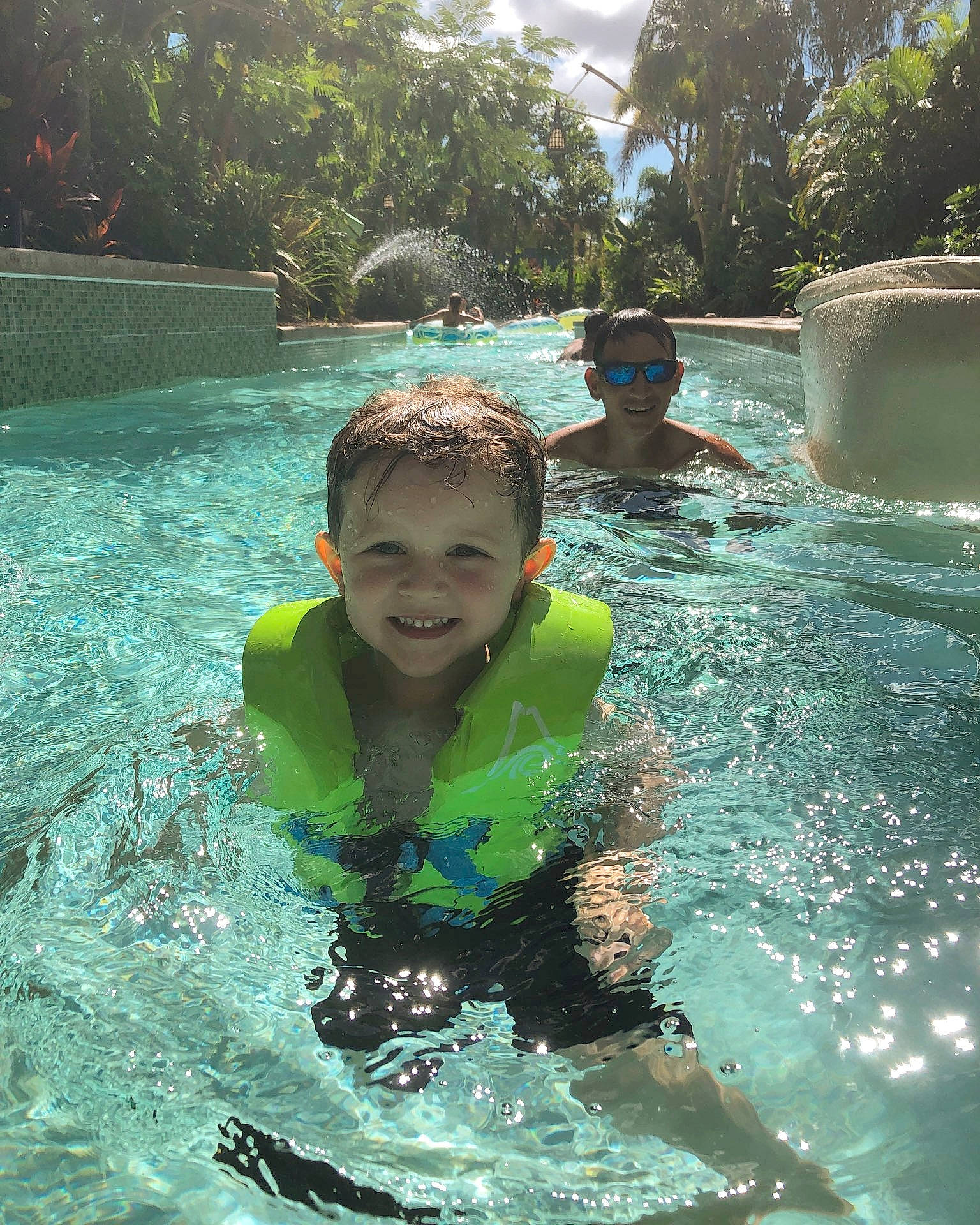 Rhyder is registered to the contest to win money with this photo: child, fun, games, happy, holiday, joy, leisure, leisure_centre, person, personal_protective_equipment, play, recreation, smile, summer, swimming, swimming_pool, toddler, tourism, vacation, water