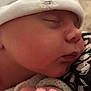 Elyanna a rejoint le concours — aidez-le/la à gagner de superbes lots ! newborn, baby, sleeping, hand, face, hat, clothing, closeup, skin, peaceful, infant, rest, cozy, soft, cute, portrait, newborn_clothing, tiny_hand, baby_face, warm