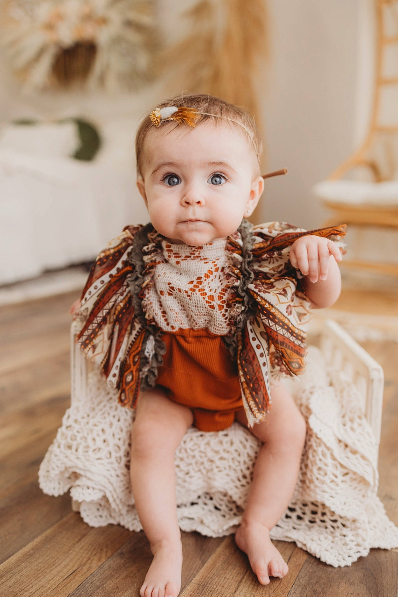 Remington is registered to the contest to win money with this photo: baby, baby_toddler_clothing, dress, embellishment, event, fashion_design, flash_photography, flooring, happy, headpiece, human_body, iris, jewellery, neck, outerwear, peach, person, skin, sleeve, toddler