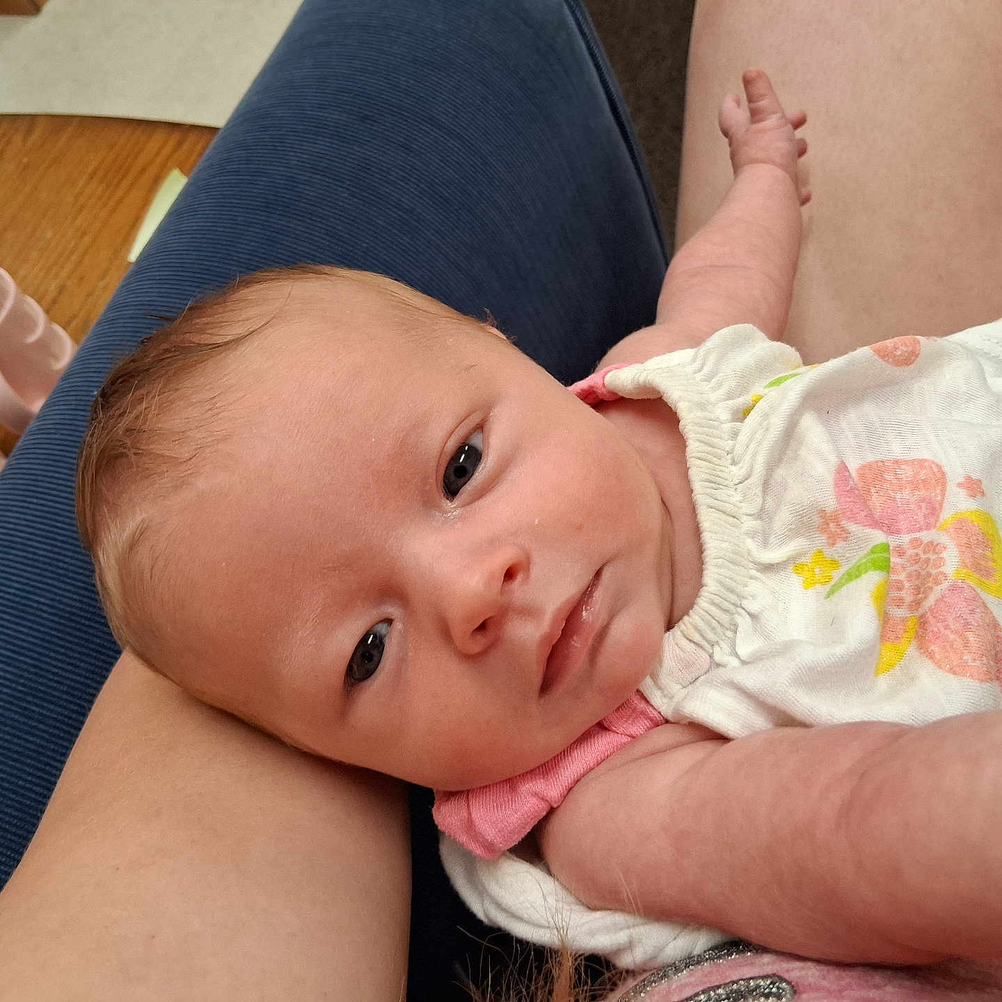 Taylin joined the competition — help win amazing prizes! newborn, baby, infant, child, face, eyes, smiling, portrait, closeup, lying_down, lap, caregiver, arms, hands, clothing, dress, pink, white, bottle, pacifier