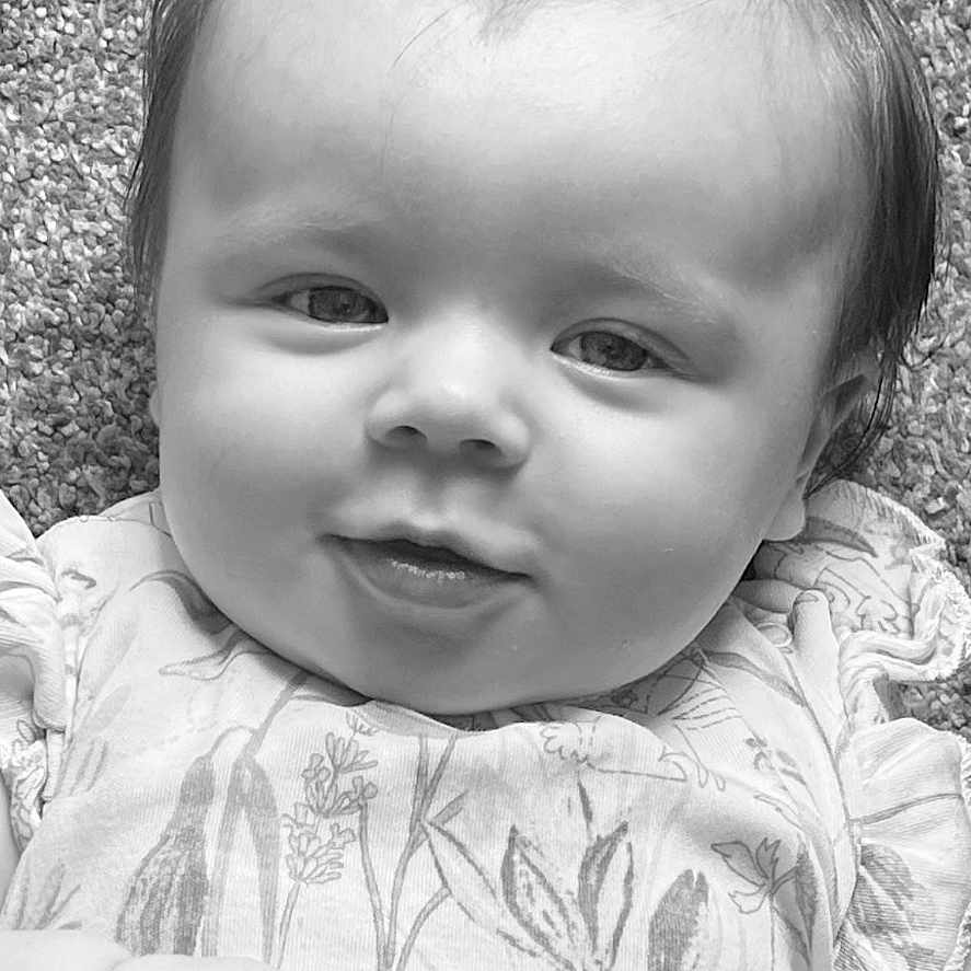 Orla Rose is registered to the contest to win money with this photo: baby, bodypart, clothing, dress, face, finger, frown, hair, hand, happy, head, laughing, mouth, newborn, person, photography, portrait, sad, smile, t_shirt