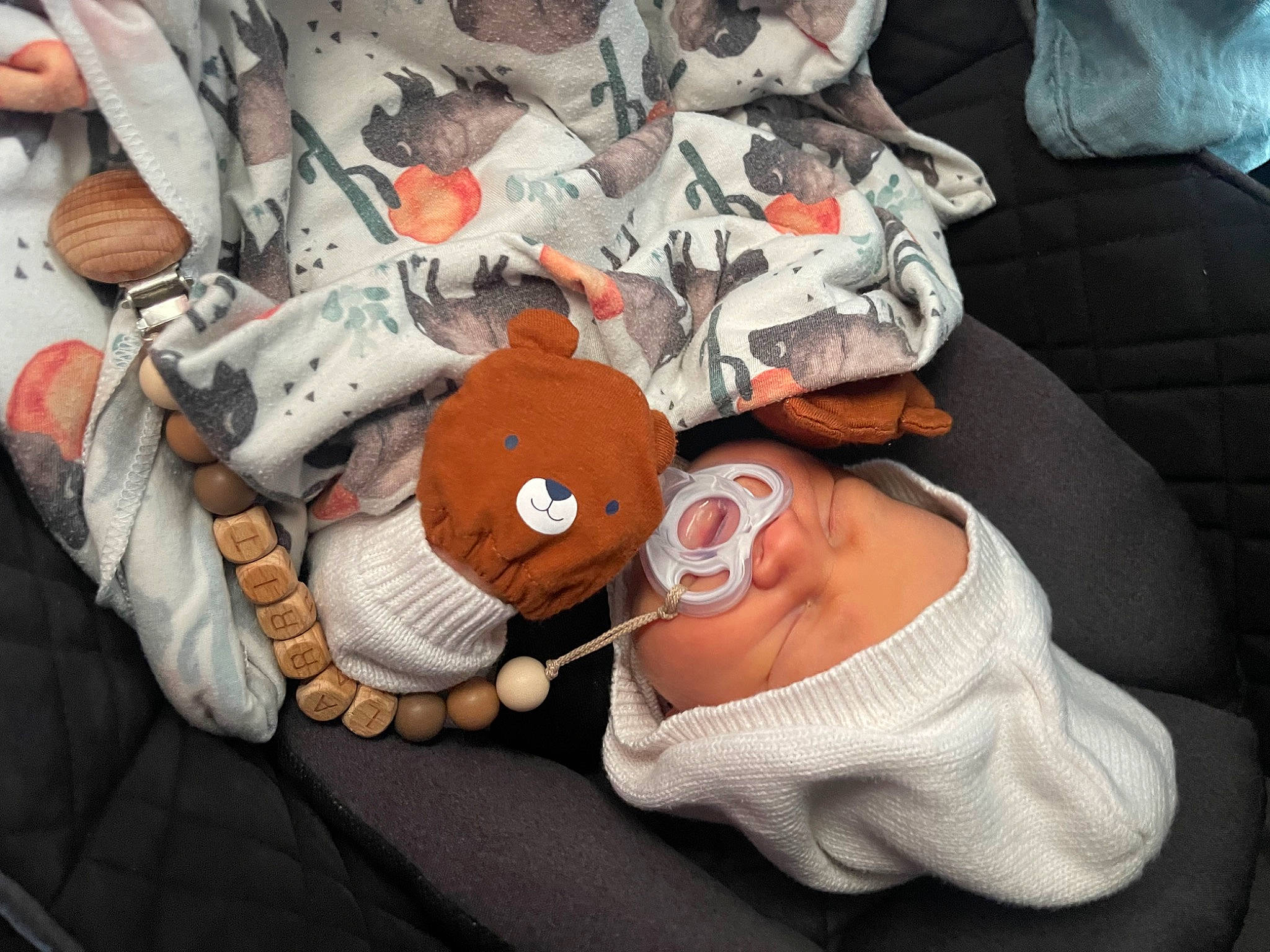 Larrit Scott is registered to the contest to win money with this photo: baby, baby_products, carmine, child, comfort, finger, flesh, hat, headgear, headwear, health_care, human_leg, linens, nail, pattern, person, personal_protective_equipment, sleeve, t_shirt, textile