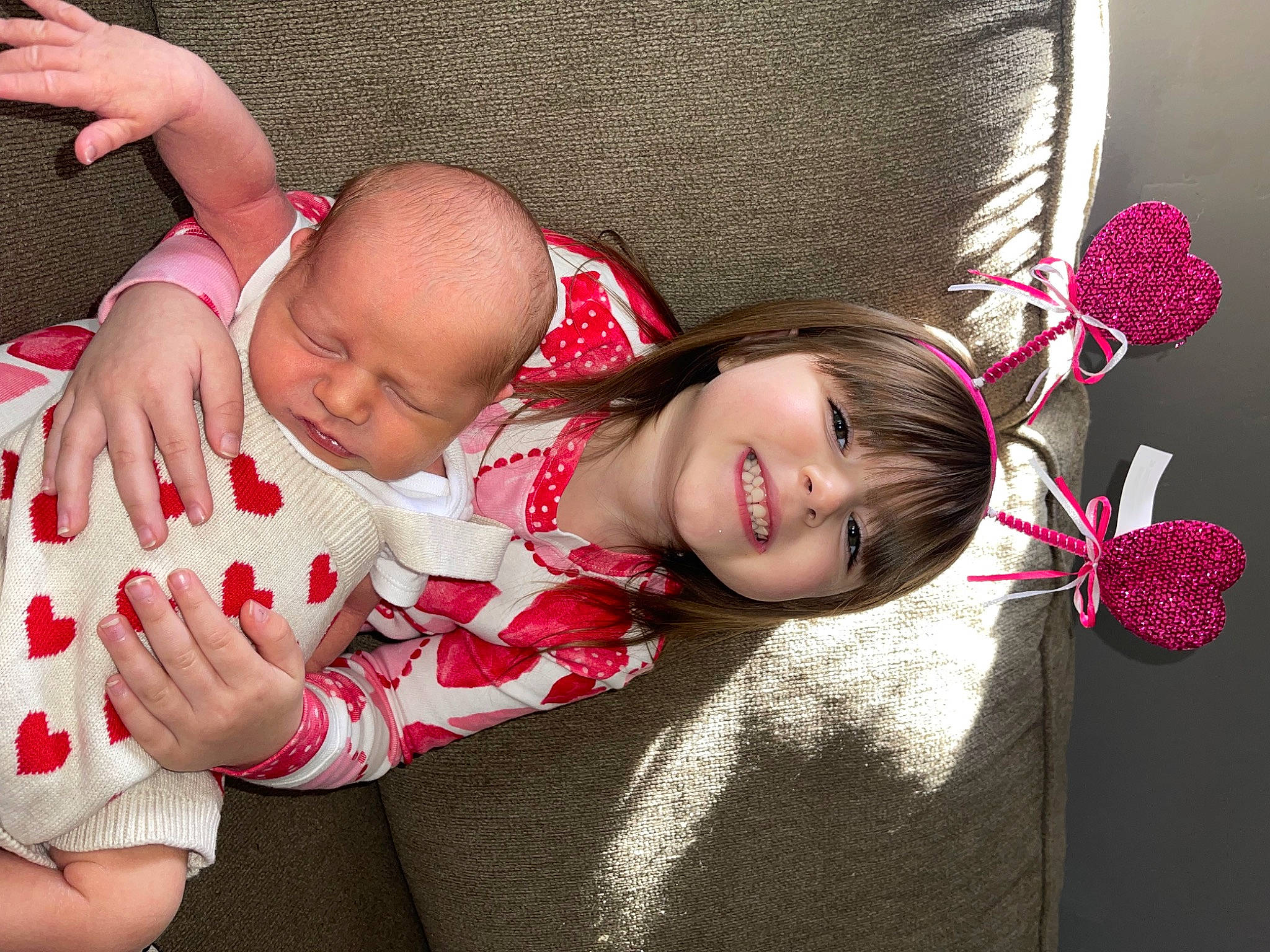 Avah Lee joined the competition — help win amazing prizes! arm, baby, baby_toddler_clothing, beauty, child, comfort, face, facial_expression, finger, gesture, hand, happy, head, joy, pattern, person, pink, red, sitting, skin