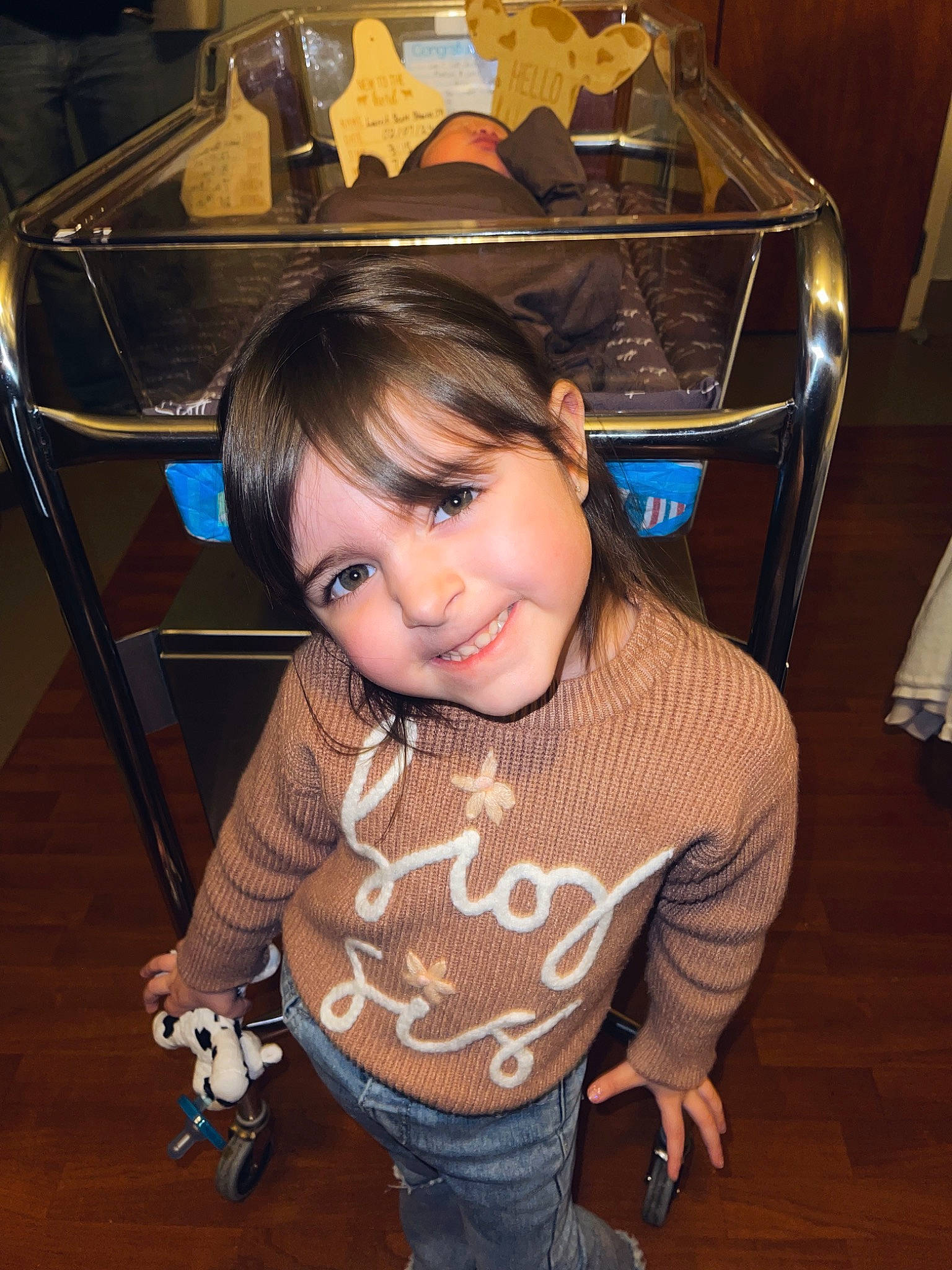 Avah Lee is registered to the contest to win money with this photo: chair, cheek, child, flash_photography, flooring, fun, happy, hardwood, home_appliance, joy, kitchen_appliance, party, pattern, person, room, sitting, sleeve, smile, t_shirt, toddler